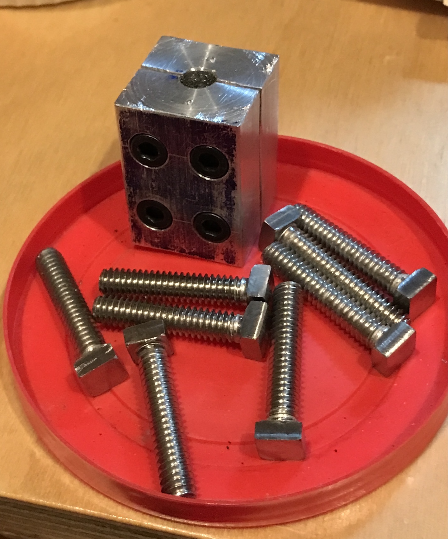 The eight square headed screws